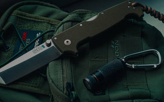 knives-and-weapons-in-bug-out-bag-darkened