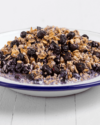 mountain-house-granola-with-milk-and-blueberries-prepared-in-bowl-on-table-yum
